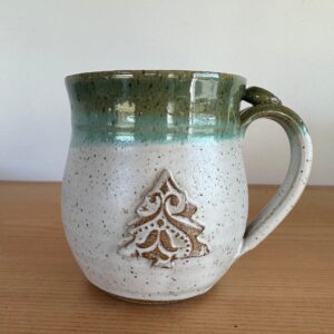 Winter pottery coffee mug with small tree decoration hot chocolate cup thumb rest